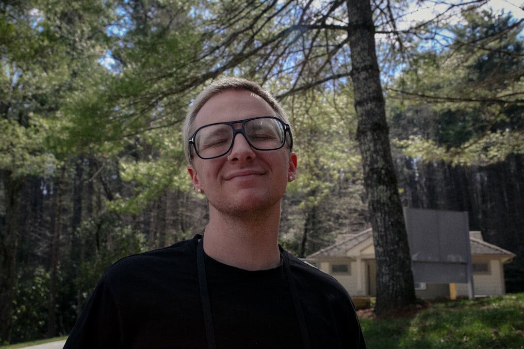 Portrait of a Finnish male live streaming trainer with glasses
