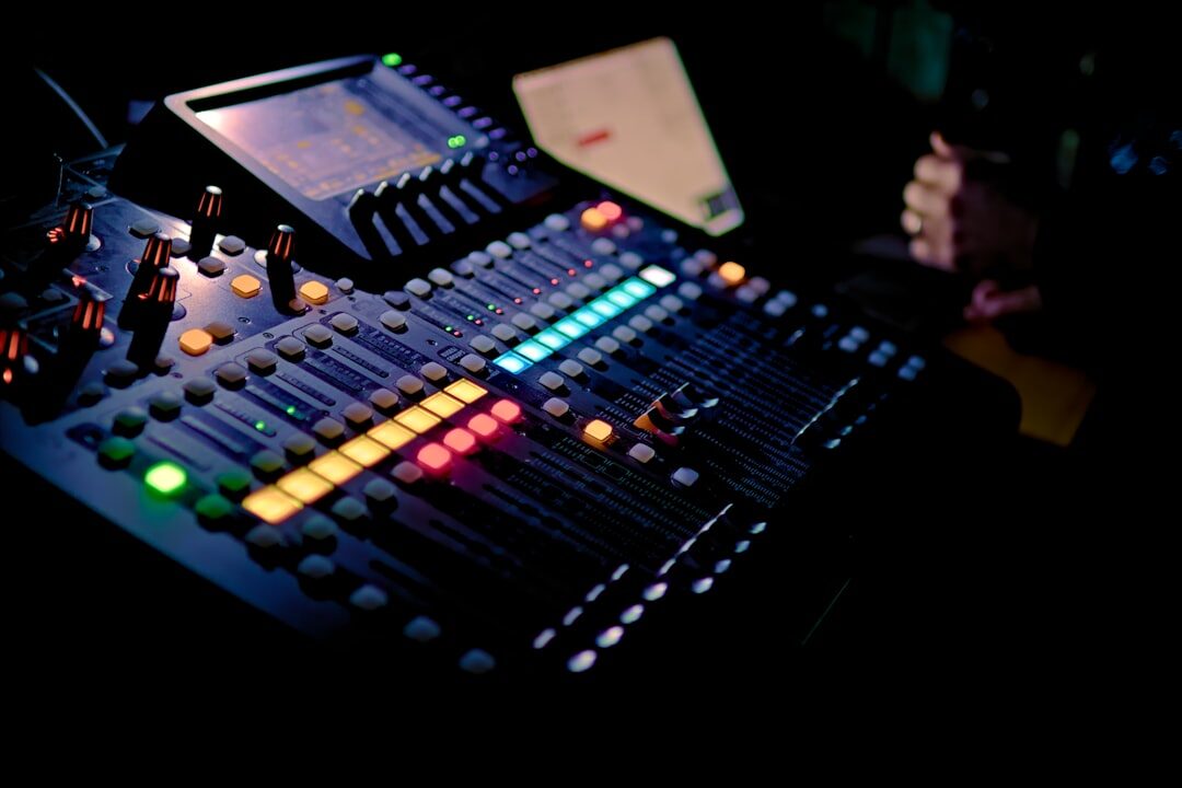 Close-up of hands operating a video vision mixer switcher panel